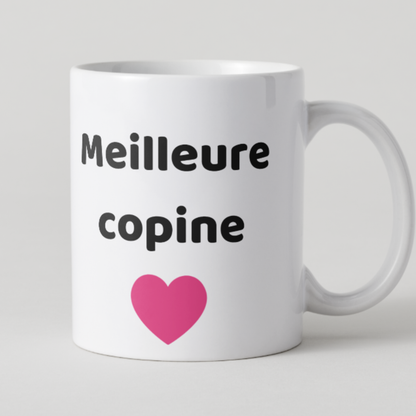 Tasse en céramique blanche avec inscription Meilleure copine et illustration d'un grand cœur rose, cadeau original pour une amie proche.