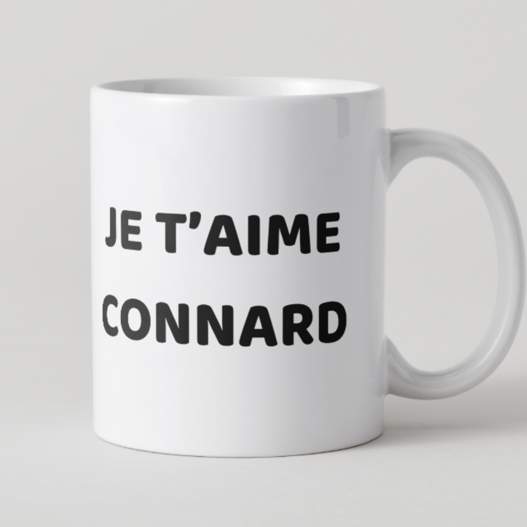 Mug blanc avec message humoristique noir Je t'aime connard.