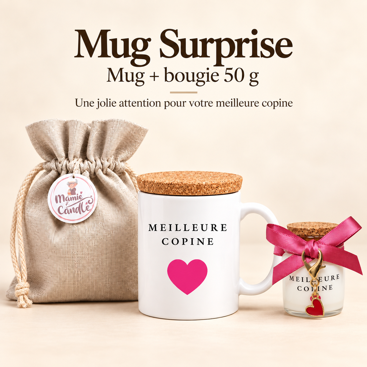 Mug blanc « Meilleure copine » avec cœur rose et couvercle en liège, accompagné d’une bougie de 50 g avec ruban rose, pendentif cœur rouge et pochon Mamie Candle.