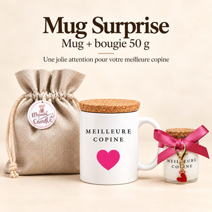 Mug blanc « Meilleure copine » avec cœur rose et couvercle en liège, accompagné d’une bougie de 50 g avec ruban rose, pendentif cœur rouge et pochon Mamie Candle.