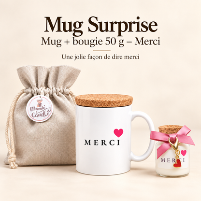 Mug blanc « Merci » avec cœur rose et couvercle en liège, accompagné d’une bougie de 50 g avec ruban rose et pendentif cœur, et d’un pochon Mamie Candle.