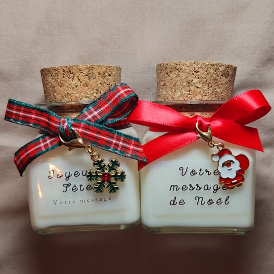 Vidéo montrant la personnalisation d'une bougie de Noël et sa lueur chaleureuse